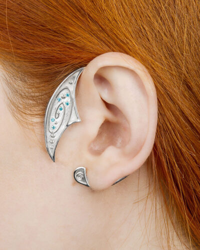Galaxy ear cuff in sterling silver with blue stones worn on ear