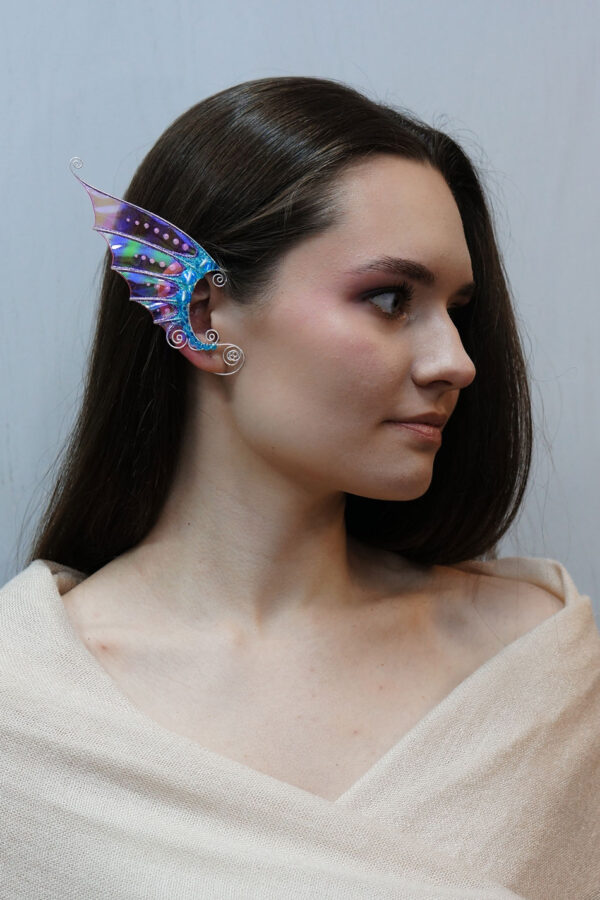 Model wearing handmade pink and blue mermaid ear cuff