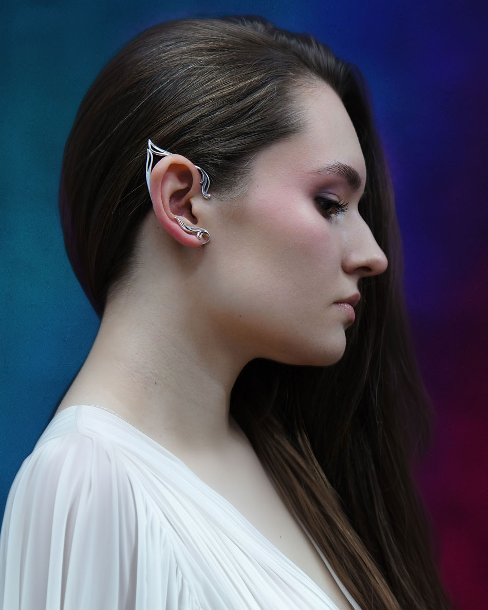 Silver elf ear cuff on model with dark hair