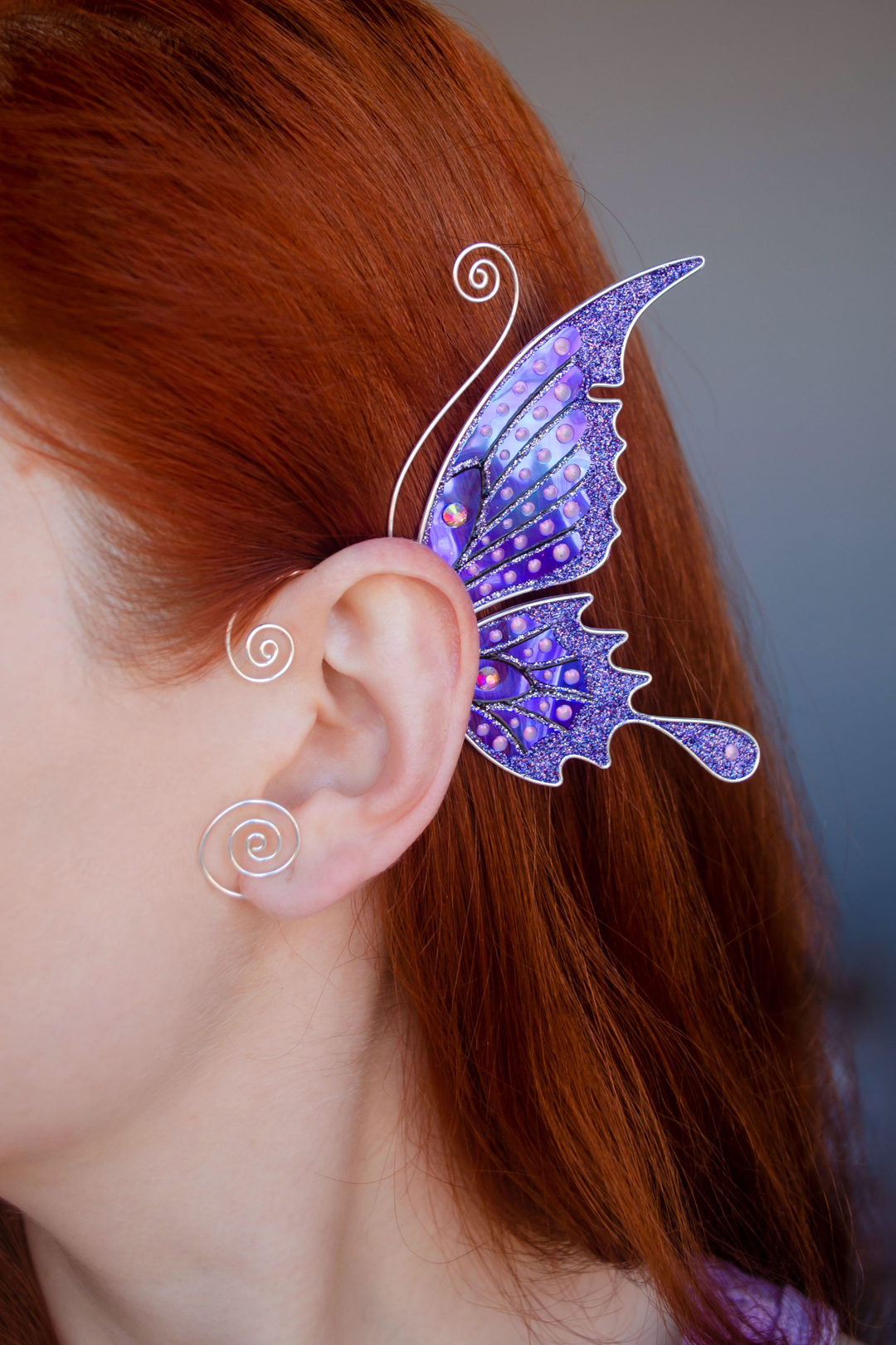 Purple butterfly ear cuff worn on red-haired model, handmade fairy wing earring, no piercing needed