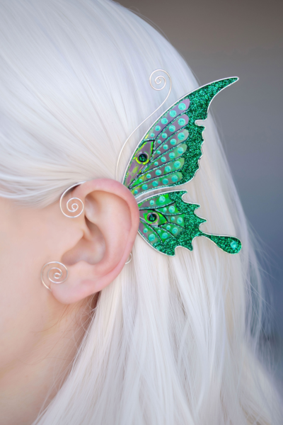 Green butterfly ear cuff worn on white-haired model, handmade fairy wing earring, no piercing needed