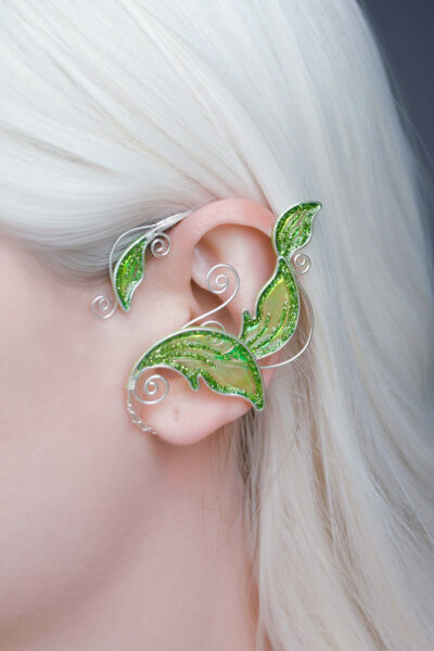 Light green handmade elven leaf ear cuff worn on ear, no piercing needed