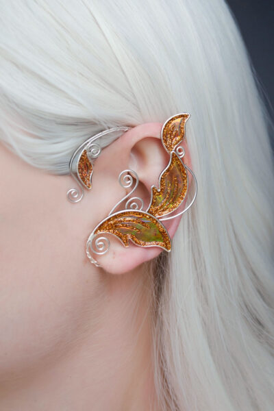 Golden elven leaf ear cuff worn on white-haired model, handmade fantasy elf cuff