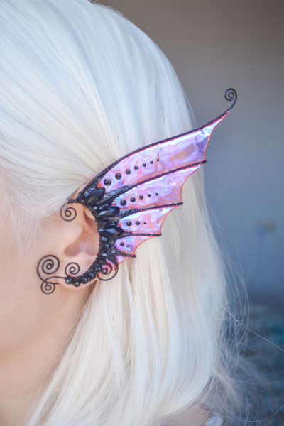 Black and scarlet mermaid ear cuff with blue and green sparkles on model with white hair, handmade fantasy earring