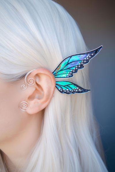 Blue-green and black fairy ear cuff worn on white-haired model, handmade no piercing needed cosplay jewelry