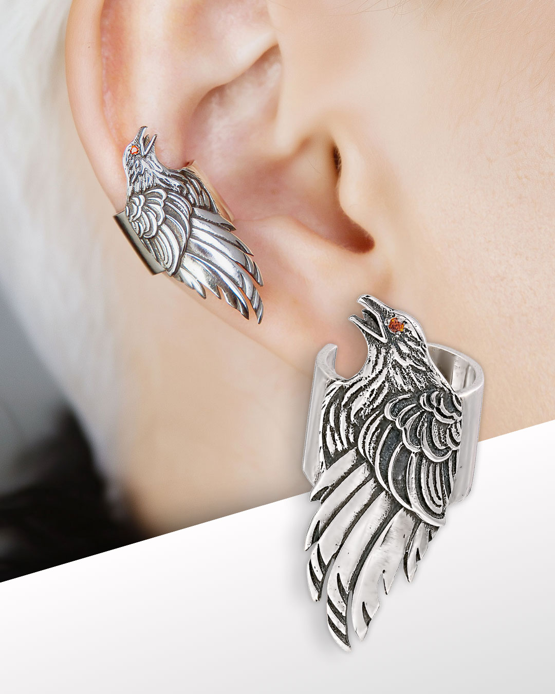 Raven ear cuff on model’s ear, sterling silver, red cubic zirconia eye