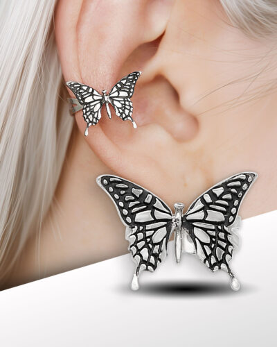 Silver butterfly ear cuff on model’s ear