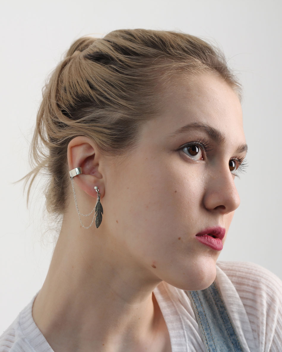 Feather chain ear cuff on blonde model, minimal style