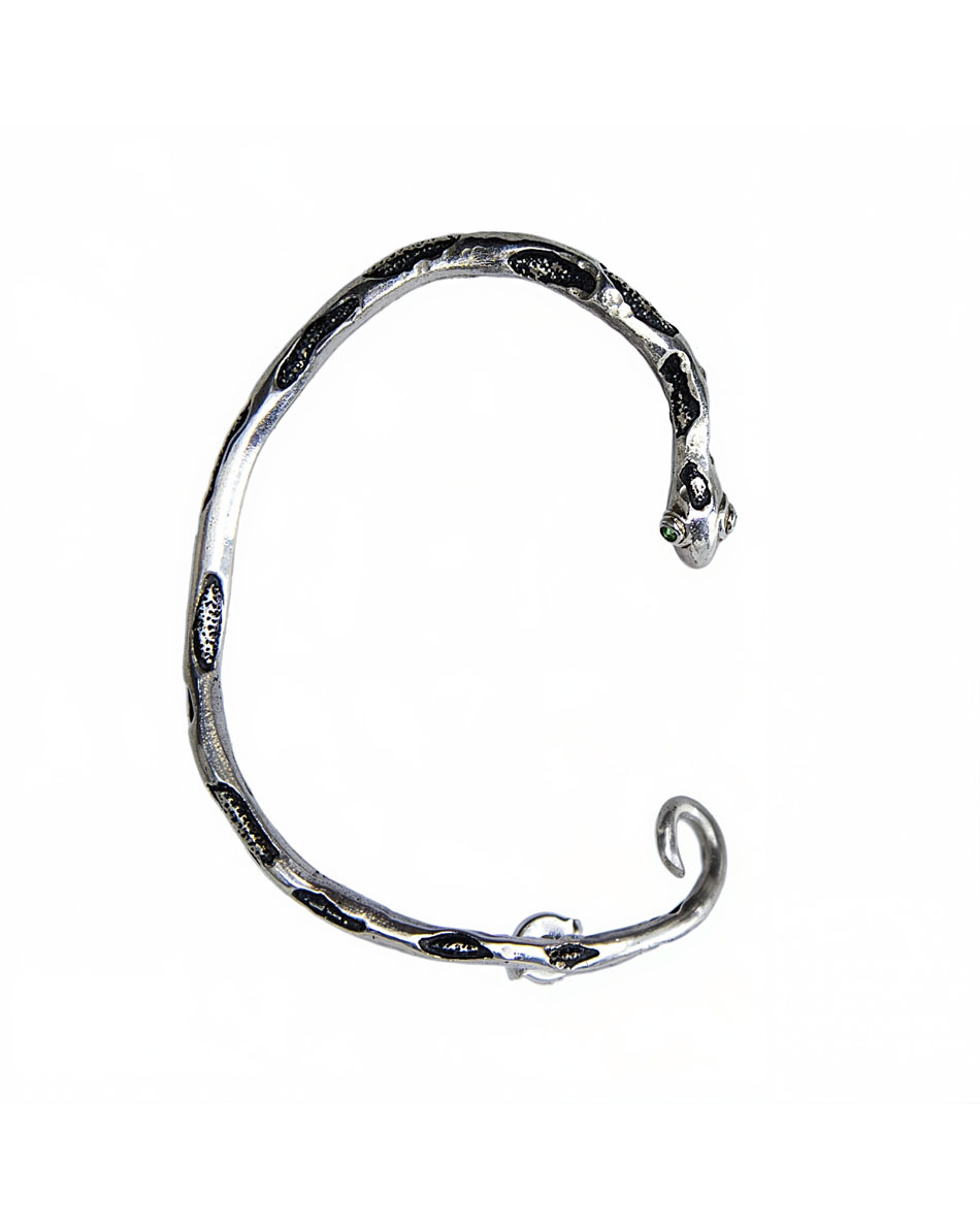 Silver snake ear cuff with green eyes, product close-up