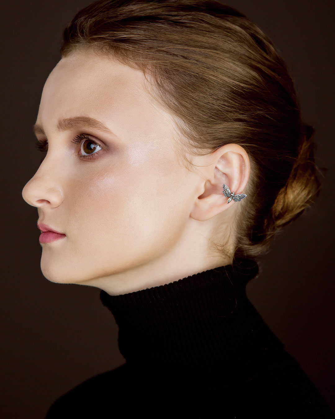 Model wearing hawk moth ear cuff, close-up