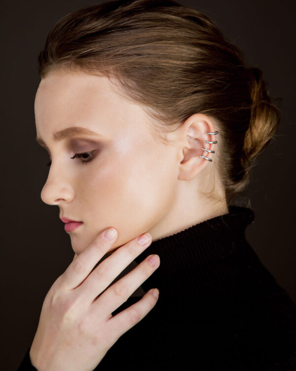 Sterling silver ear cuff with four stacked bands, worn on ear as fake piercing, no piercing required, unisex jewelry