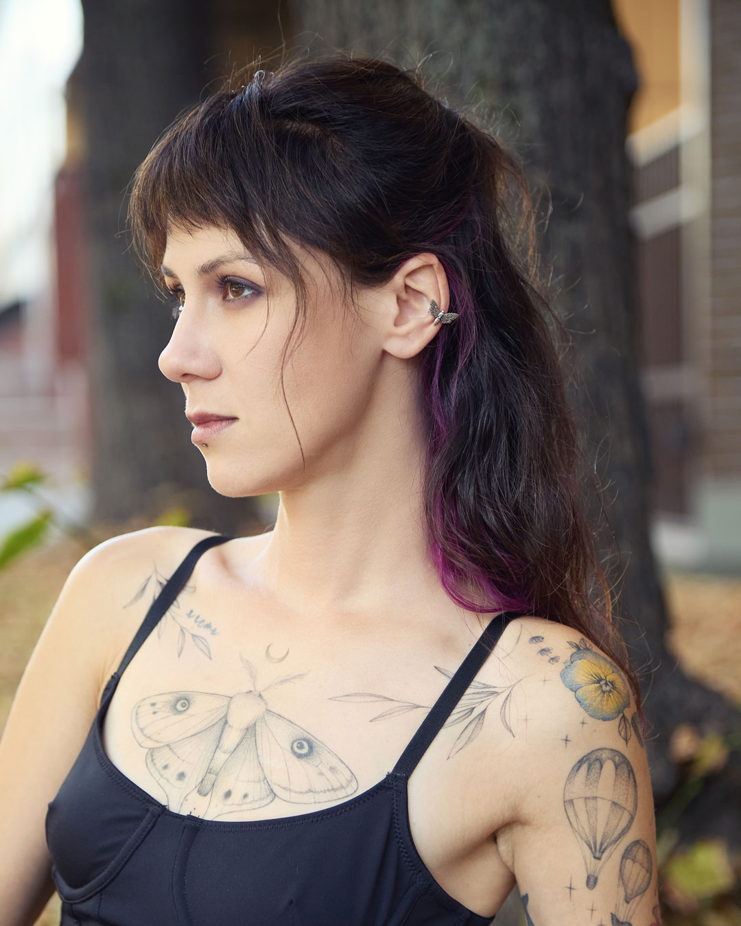 Hawk moth ear cuff on model with dark hair