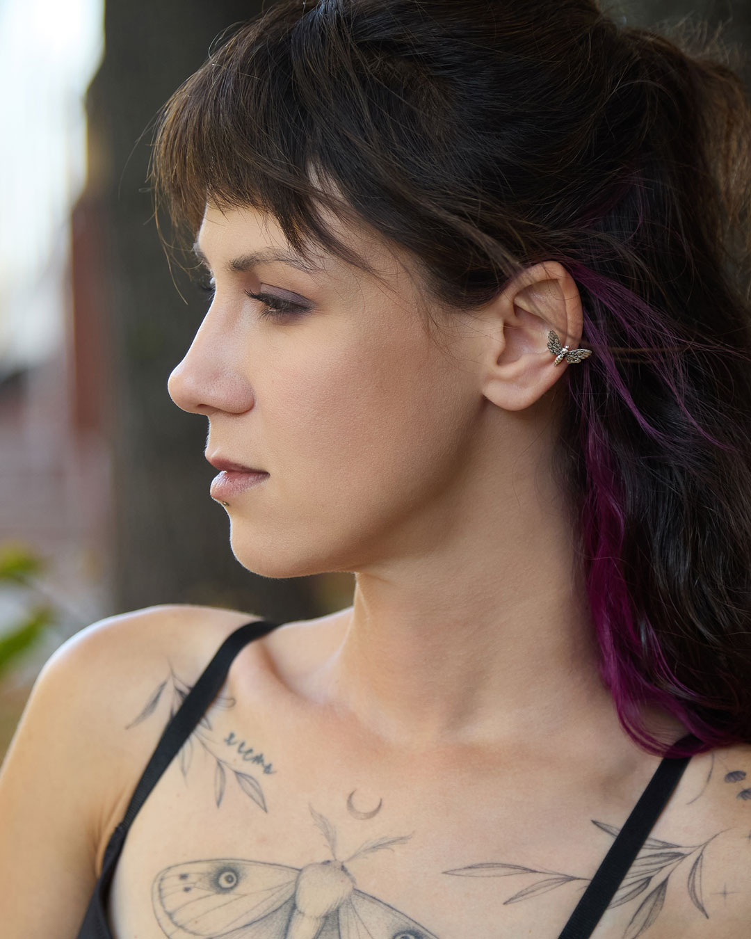 Side profile with sterling silver hawk moth ear cuff