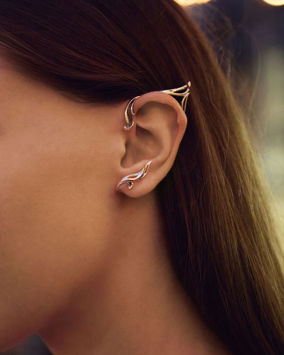 Close-up of silver elf ear cuff at night