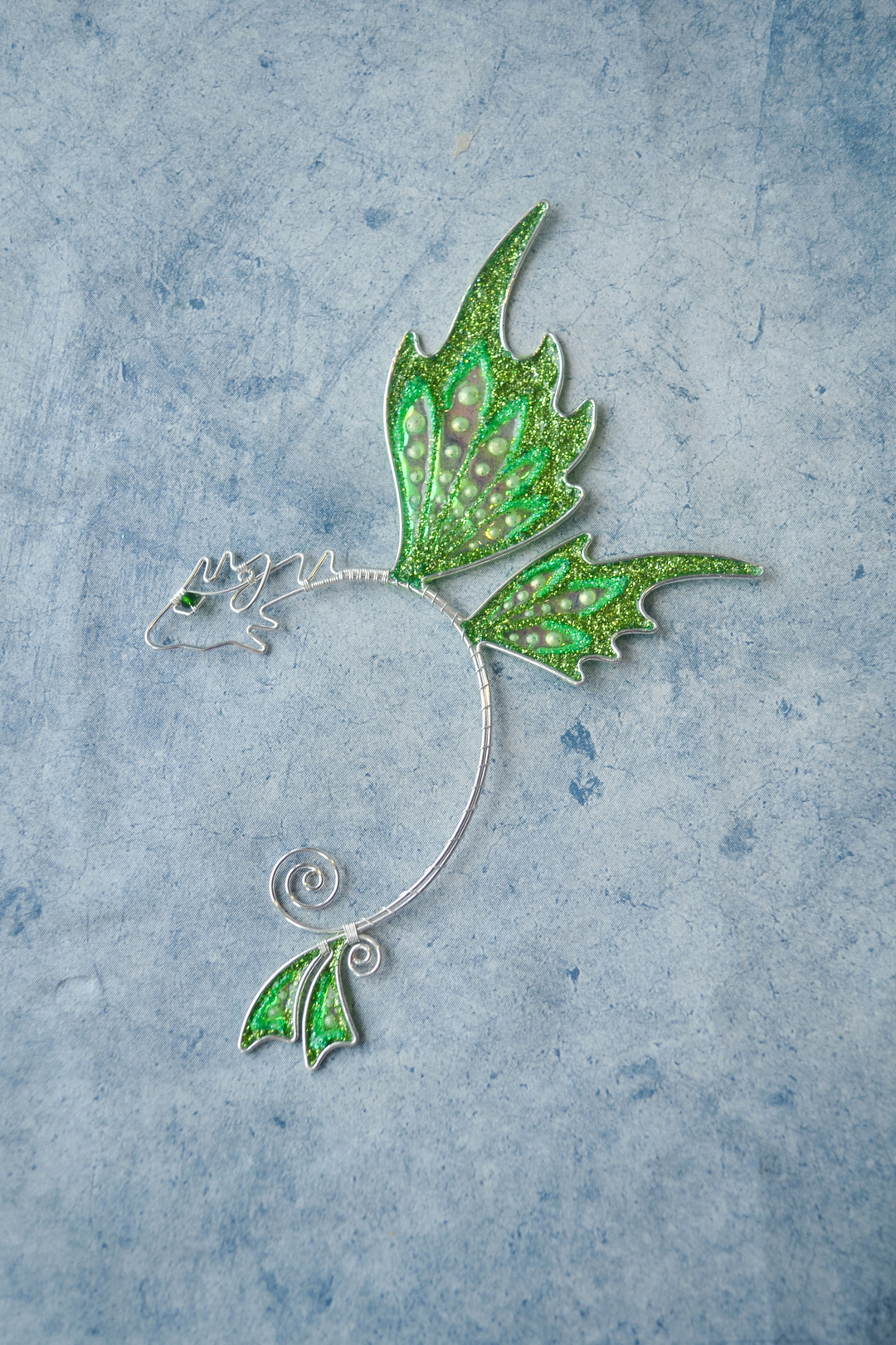 fantasy dragon ear cuff flat lay, handmade dragon ear cuff, no piercing needed