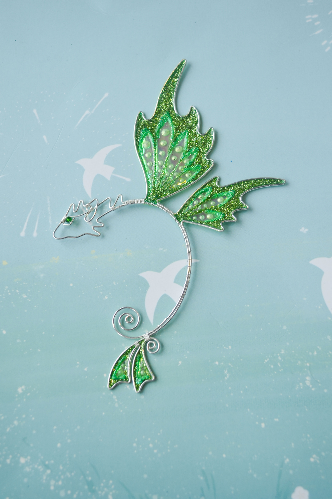 fantasy dragon ear cuff flat lay on blue background, fairy costume jewelry