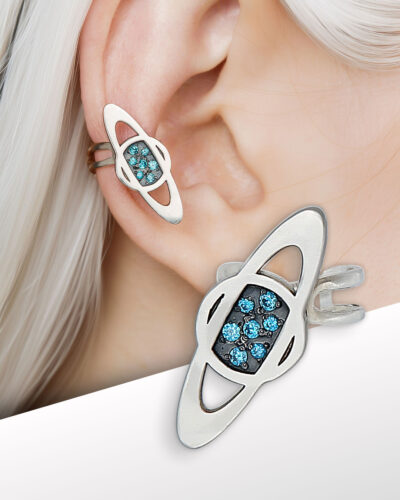 saturn ear cuff on ear, sterling silver with blue cubic zirconia, close-up