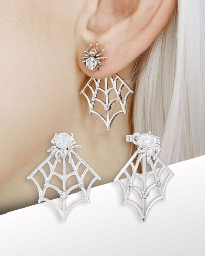 close-up of spider web ear jacket earrings worn on the lobe with clear stones
