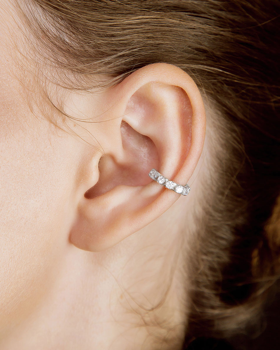 Silver cartilage ear cuff with clear stones worn on ear