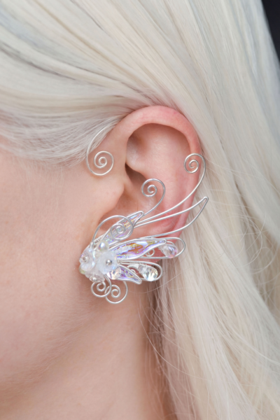 Elven flower ear cuff worn on white-haired model, handmade no-piercing fantasy accessory