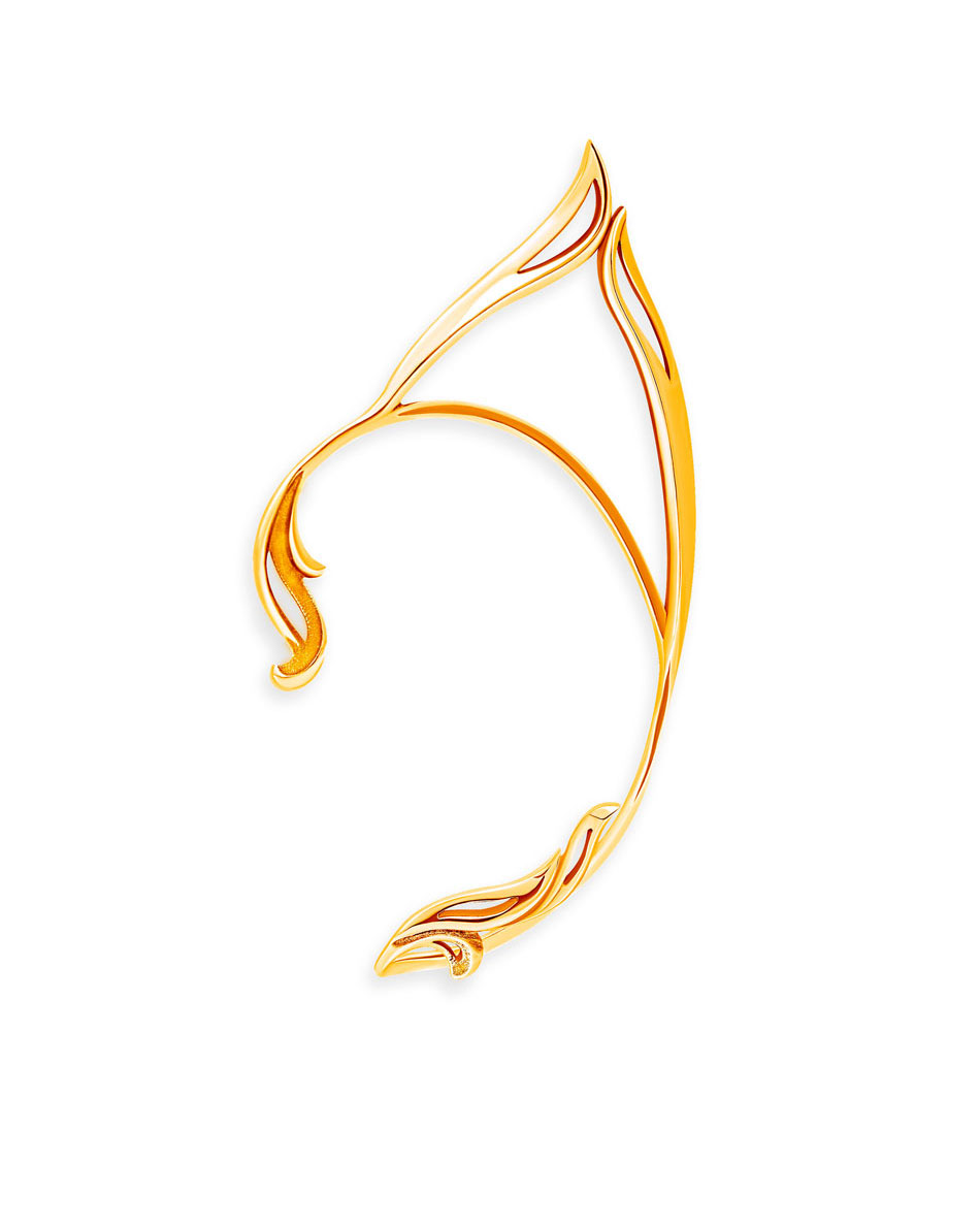 Gold elf ear cuff, close-up on white background