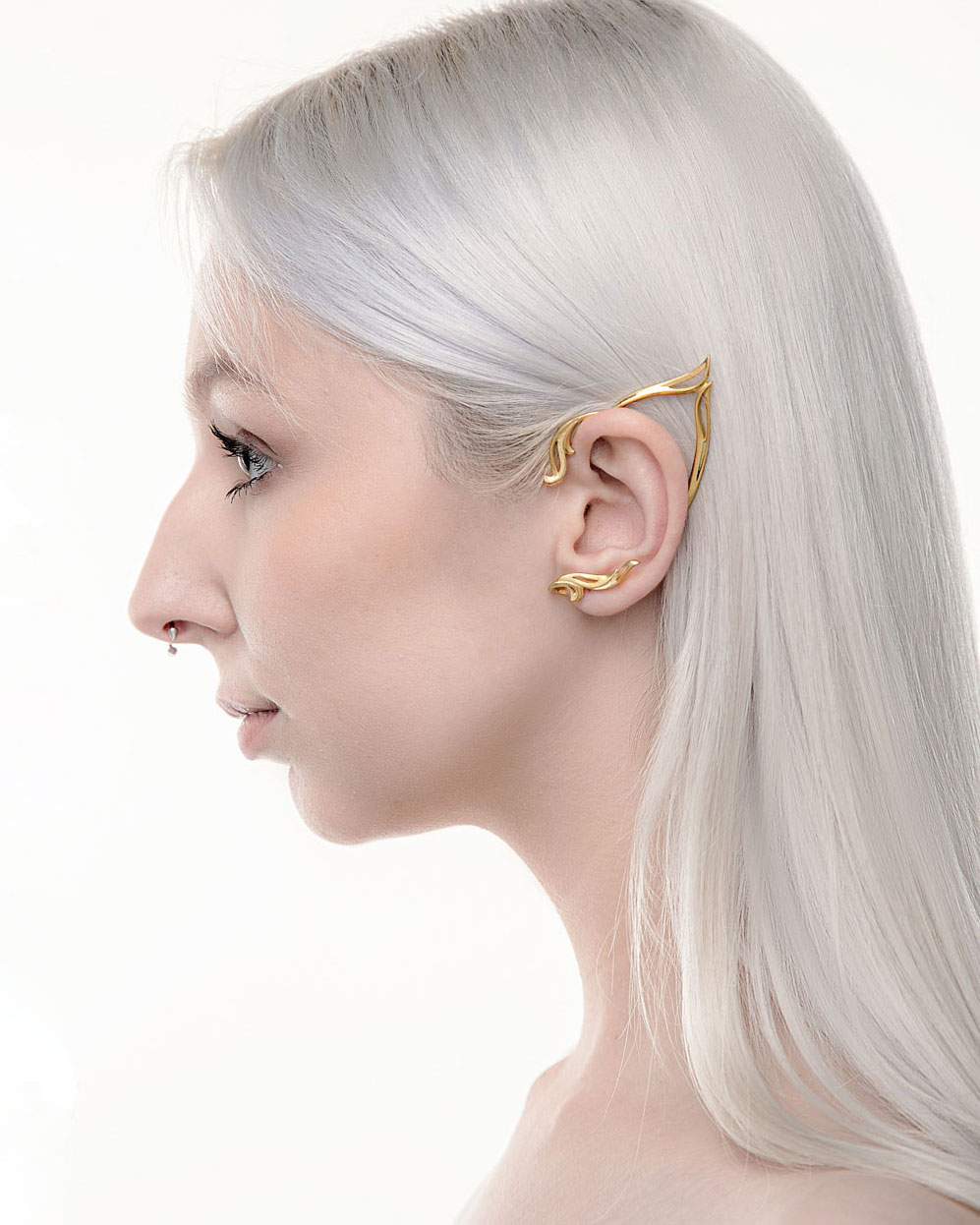 Gold elf ear cuff on model with long silver hair