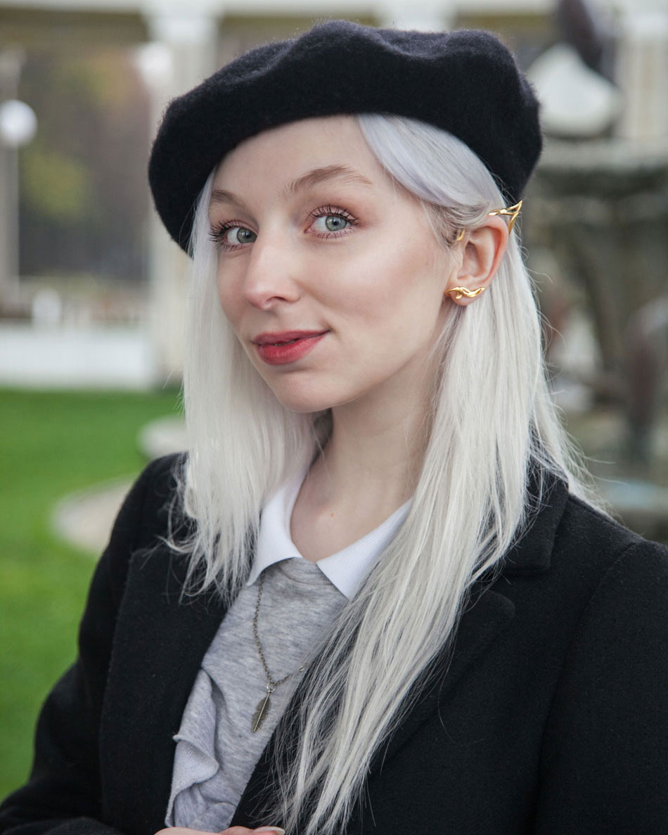 Gold elf ear cuff styled with beret and coat