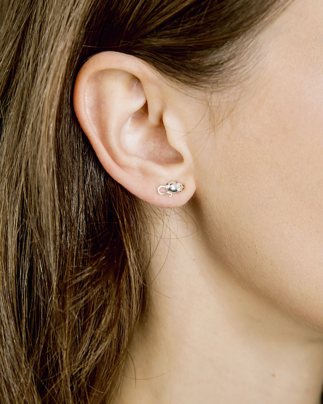 Single silver mouse stud on ear
