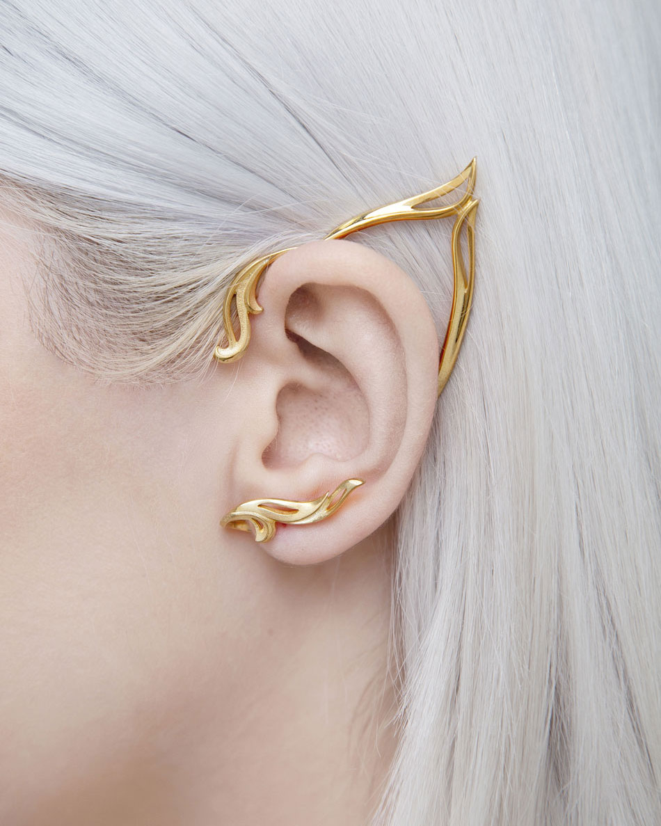 Close-up of gold elf ear cuff on ear