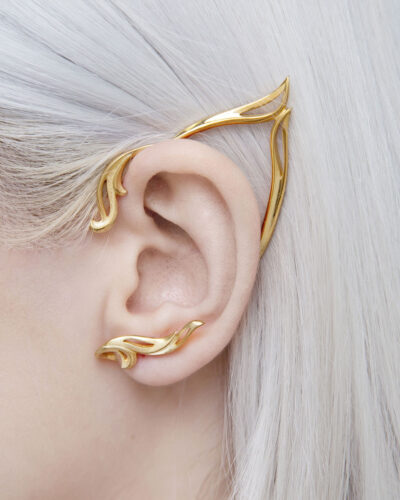 Side view of gold elf ear cuff on ear