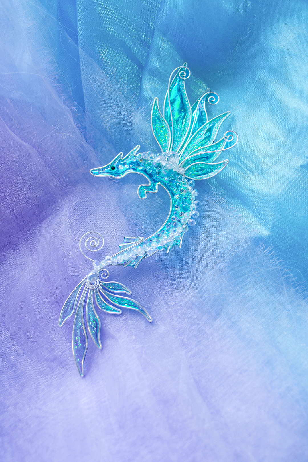 sea dragon ear cuff handmade mermaidcore jewelry flat lay