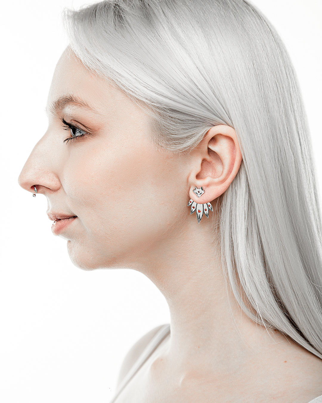Fox ear jacket earrings in sterling silver with red cubic zirconia on model