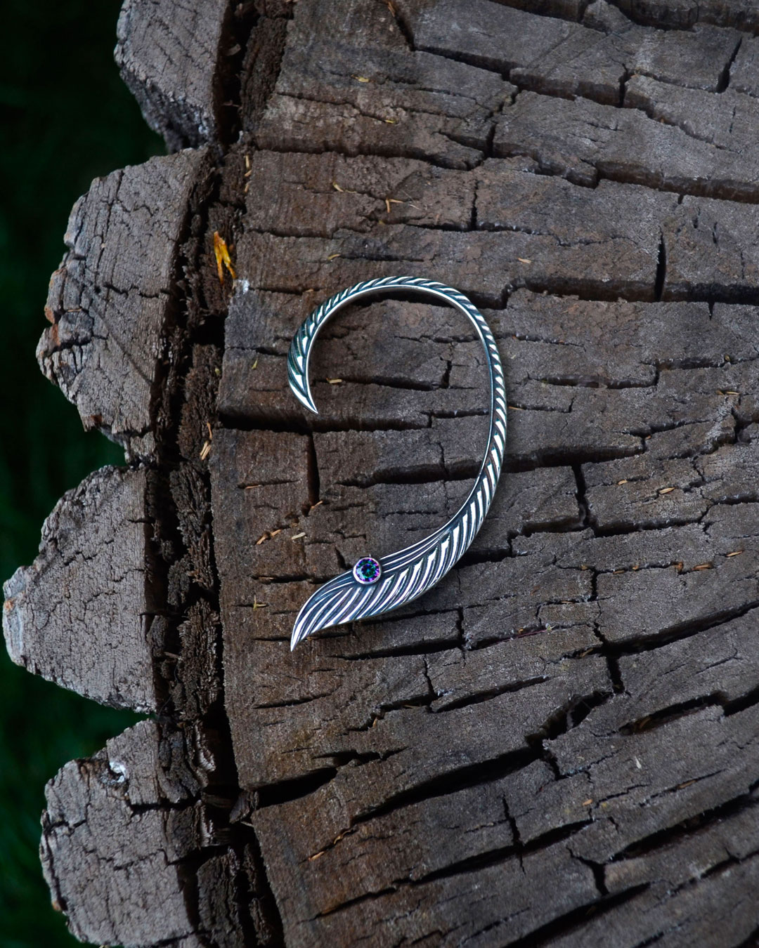 Elven ear cuff with stone on wooden surface