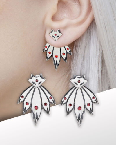 Close-up fox ear jacket earrings with detachable tail design