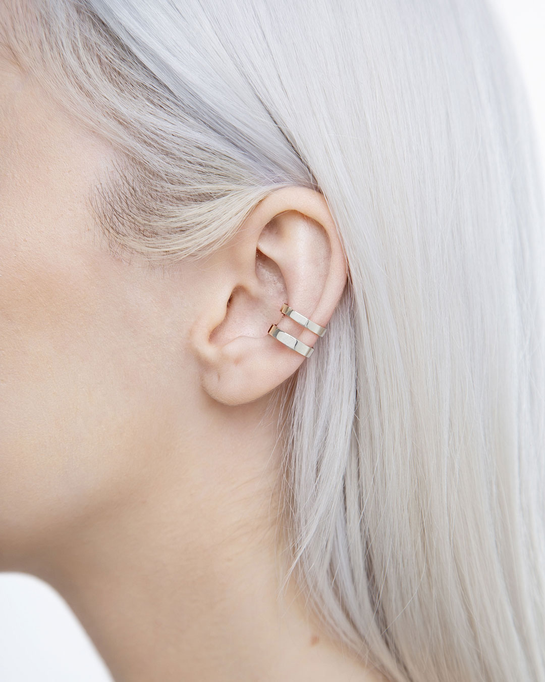 Model wearing two-band sterling silver ear cuff