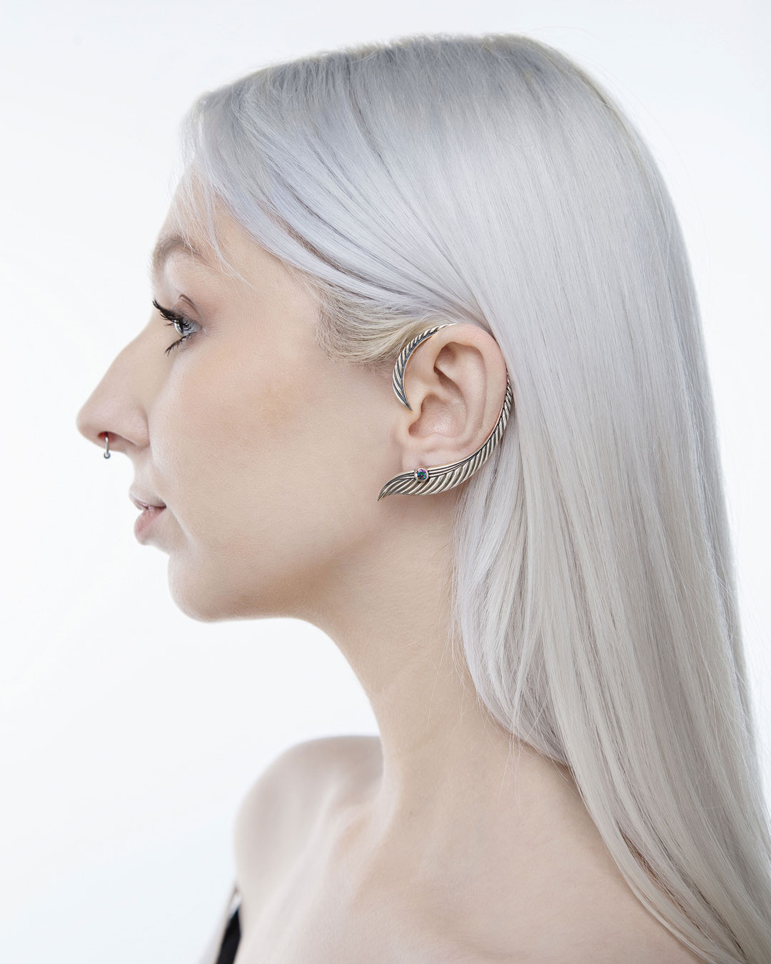 Model wearing elven ear cuff with stone