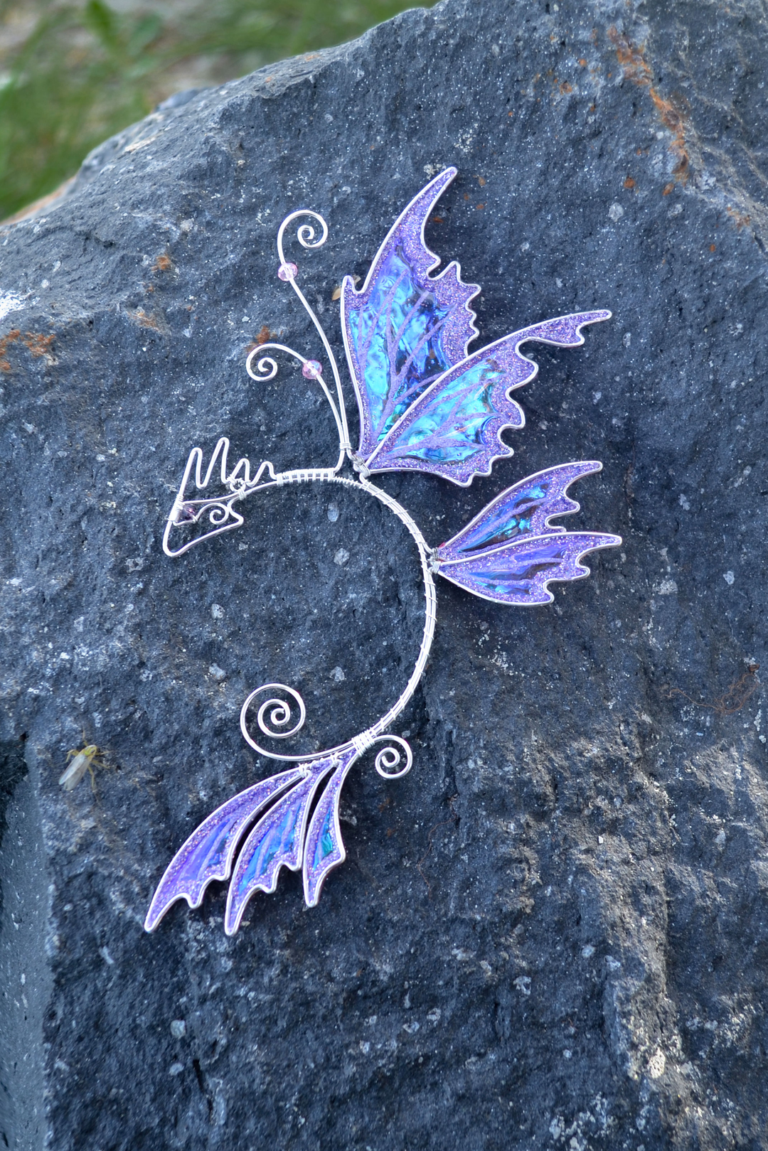 fairy dragon ear cuff on stone, handmade fantasy jewelry with dragon wing shape