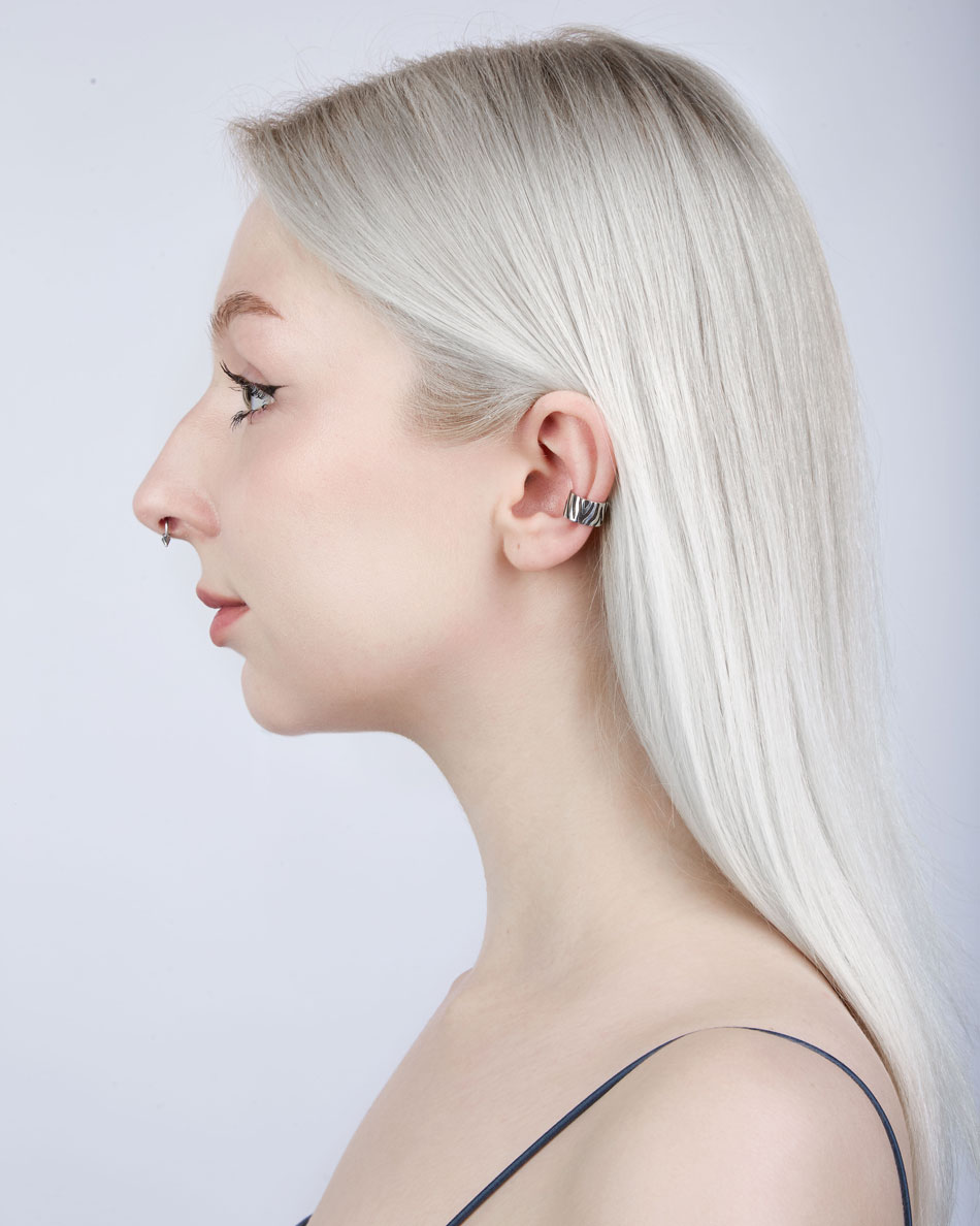 Model wearing zebra ear cuff, side profile