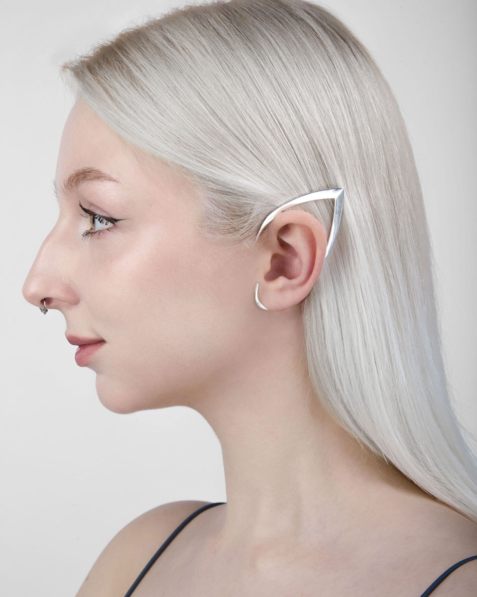 Silver elf ear cuff on model with platinum blonde hair
